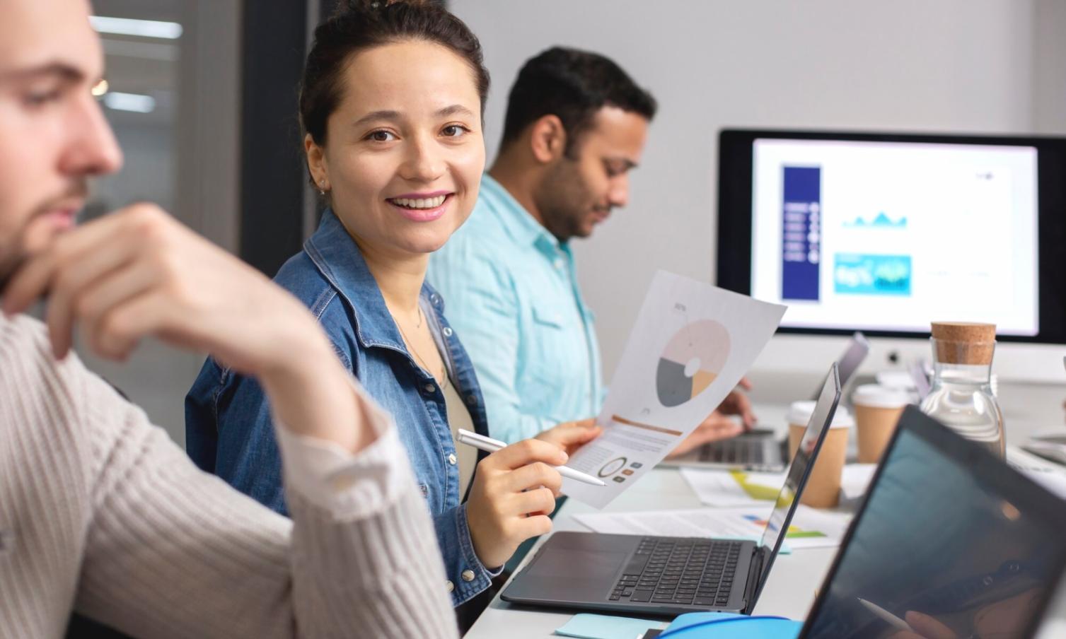 Business team collaborating on financial comparison analysis using elthoraviaq comparative tools